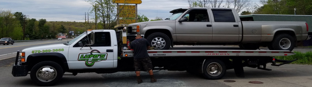 Lupo's Auto Repair and Towing company banner