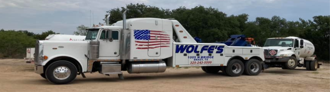 Wolfe's Towing & Rental company banner