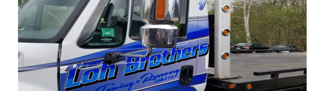 Loh Brothers Towing company banner