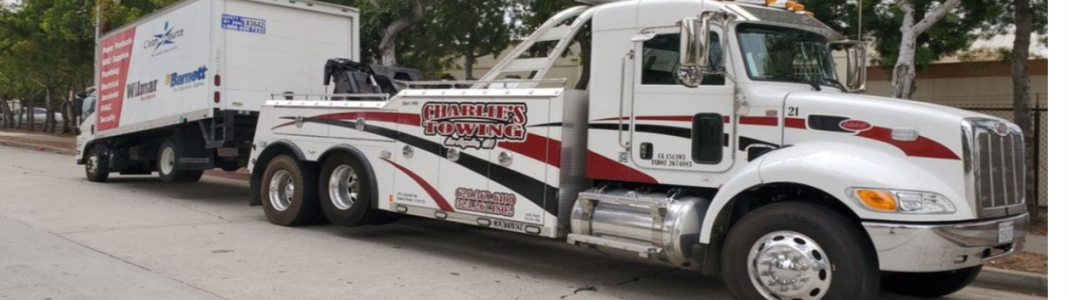 Charlie's 24 HR Heavy Towing company banner