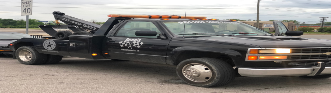 Doug's Custom Auto & 24 Hour Towing company banner